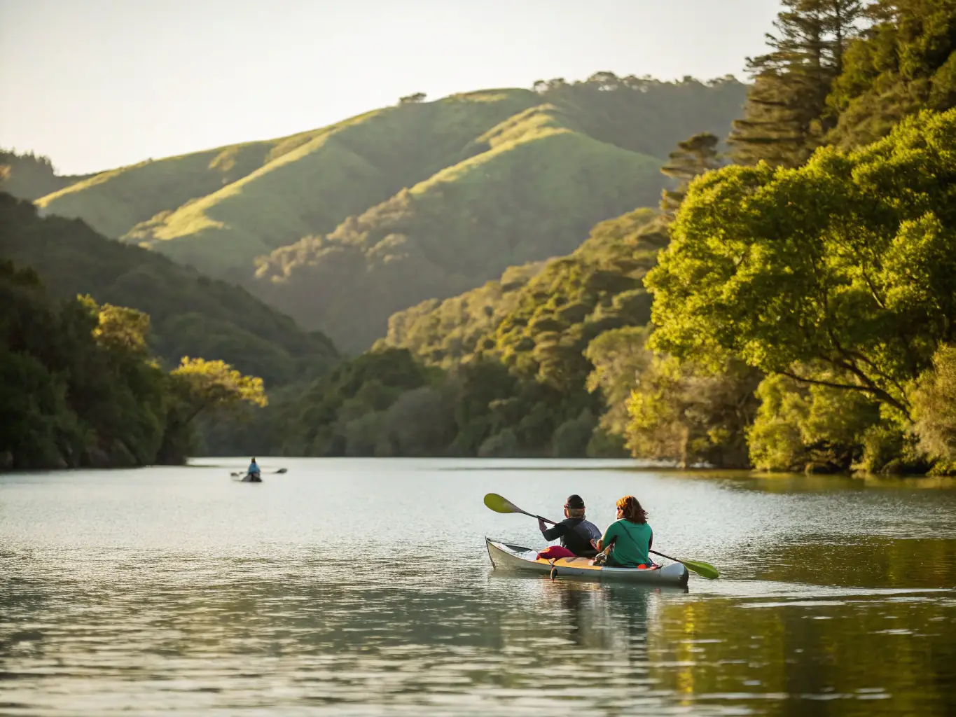 A vibrant image of participants kayaking on a calm lake surrounded by lush greenery, with instructors guiding a group.